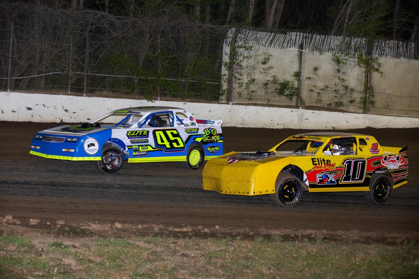 Aaron Poe (45) and Marc Carter (10) compete for the win on opening night at Central Missouri Speedway!  Photo by Josh Allee.